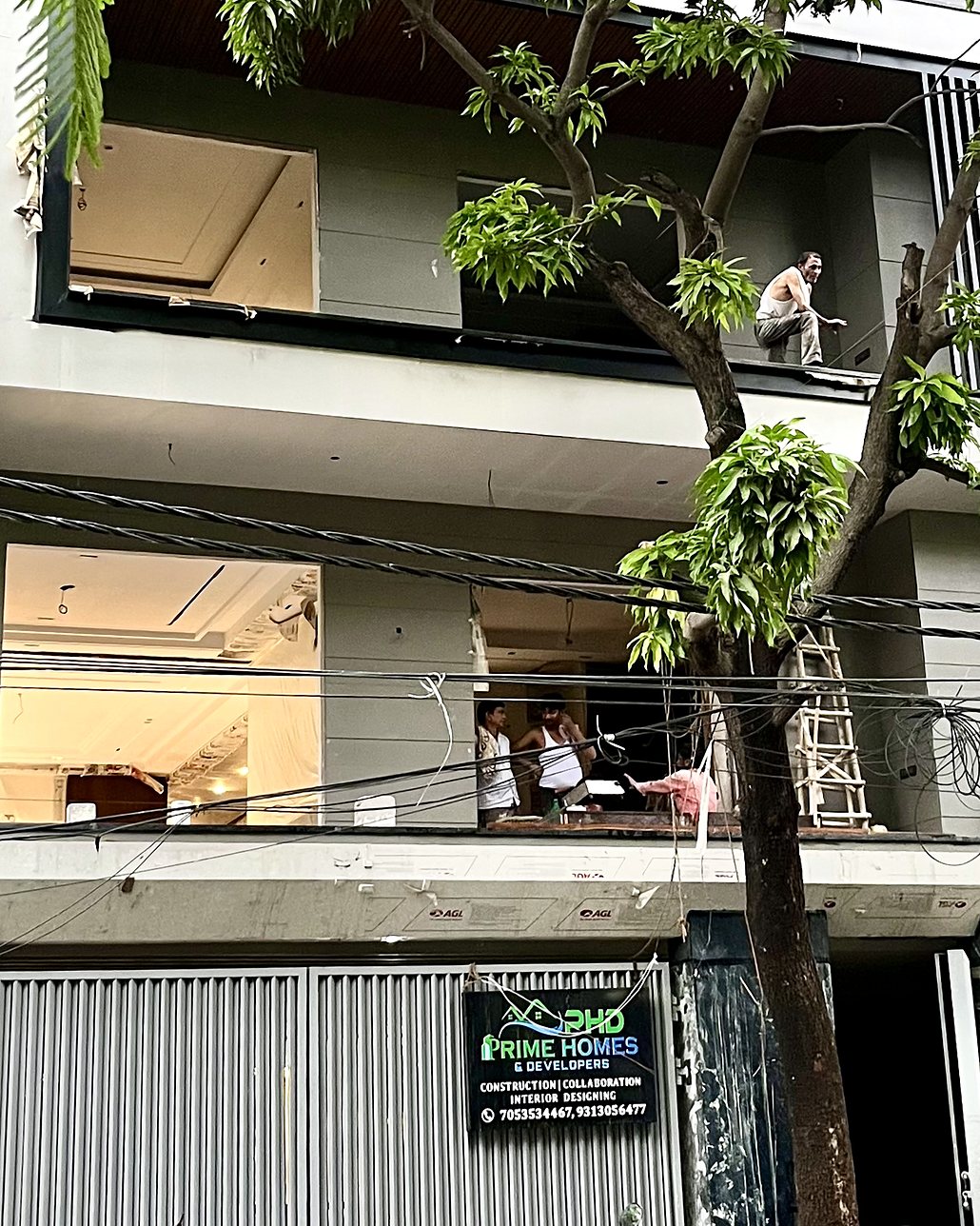 Site A — a completed Prime Homes Stilt + 4 facade, West Delhi